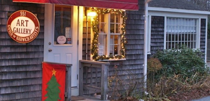 A house with a red awning and a christmas tree.