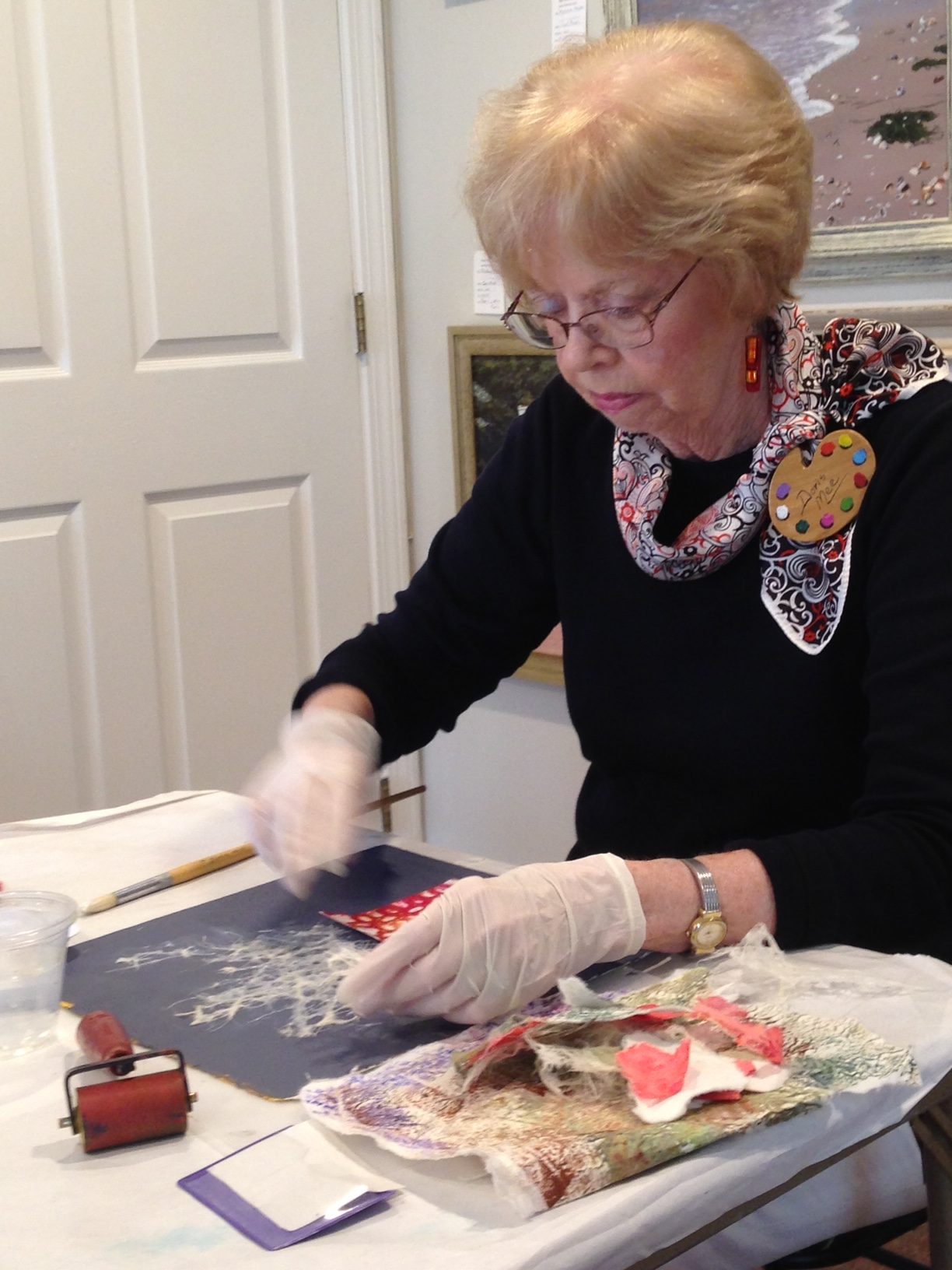 Doris Mee demonstrating her technique of mixed media and collage ©Guild of Harwich Artists