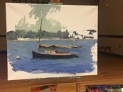 A painting of a sailboat on an easel.