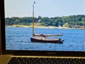 A picture of a sailboat on a laptop screen.