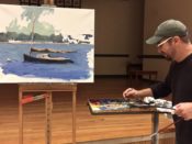 A man in a hat painting a boat on a easel.