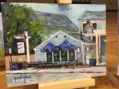 A painting of a restaurant on easels.