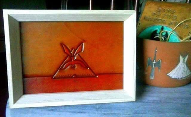 A picture of a teepee in a frame.