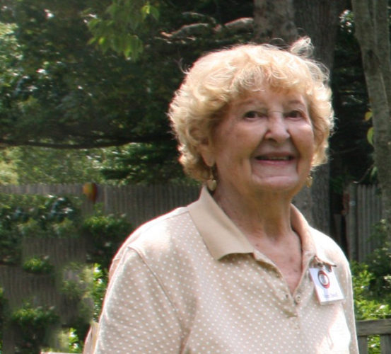 A woman smiling at the camera.