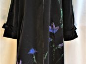 A black coat with flowers on it.