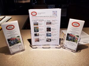 Three brochures on a counter top.
