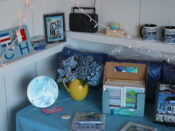 A blue table with a lot of items on it.