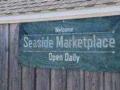 Seaside marketplace open daily sign.