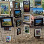 Paintings displayed on some fence
