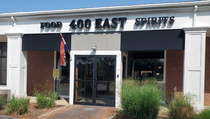 A building with a sign that says food 400 east spirits.